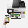 canon maxify gx7040 wireless colour all in one refillable megatank inkjet printer product front view with a person printing from a smartphone.jpg